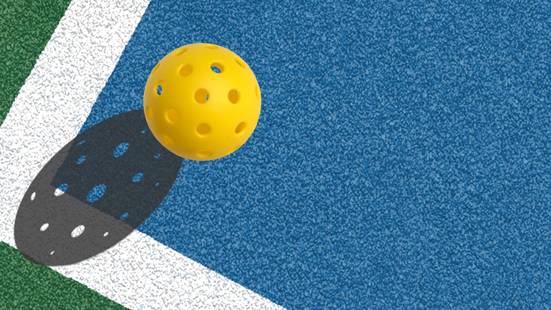 pickleball court pain with yellow outdoor pickleball with pickleball shadow